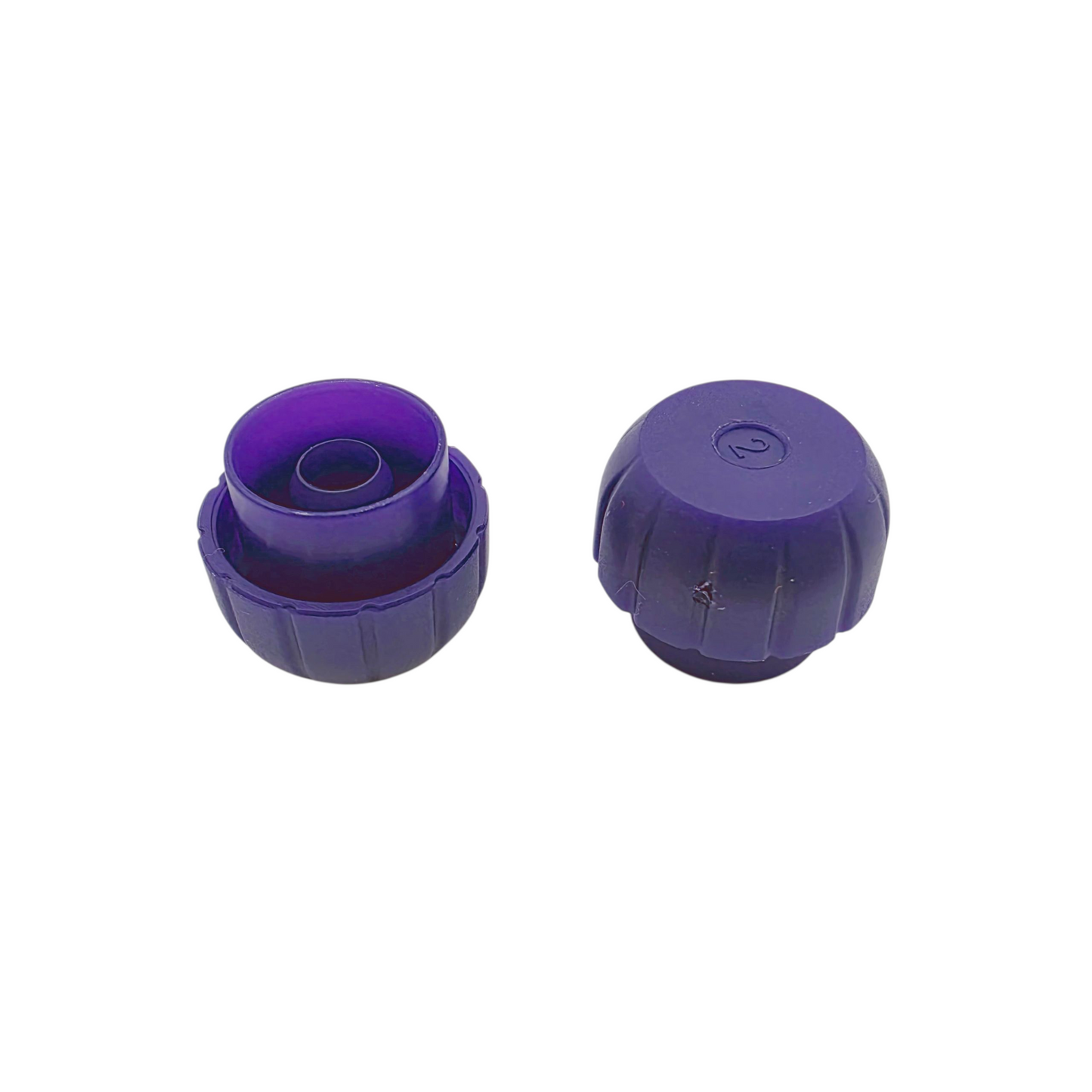 Two purple Enfit syringe caps on a white background