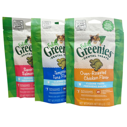 Three packages of Feline Greenies dental treats with different flavors on a white background.