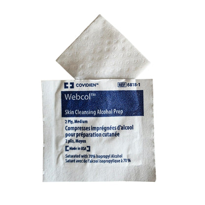 An open Covidien Webcol skin cleansing alcohol prep packet on a white background