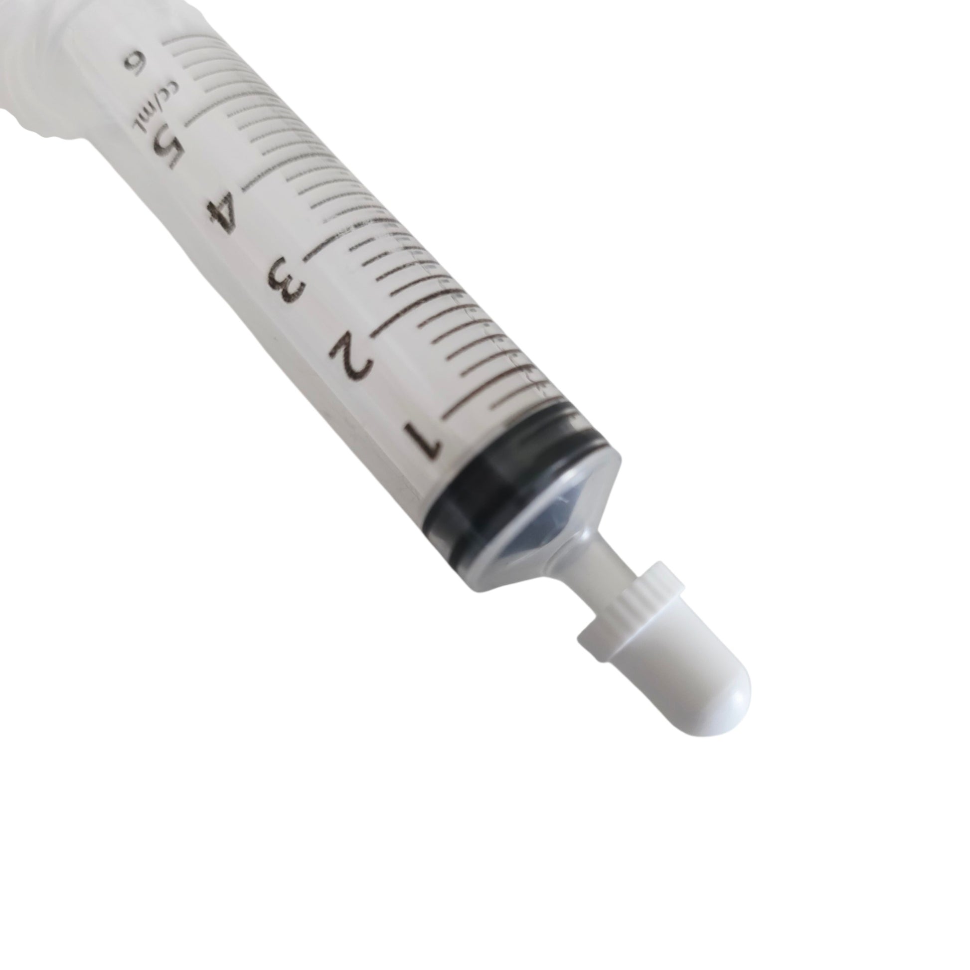 Medical syringe with a syringe cap and  measurement markings on a white background