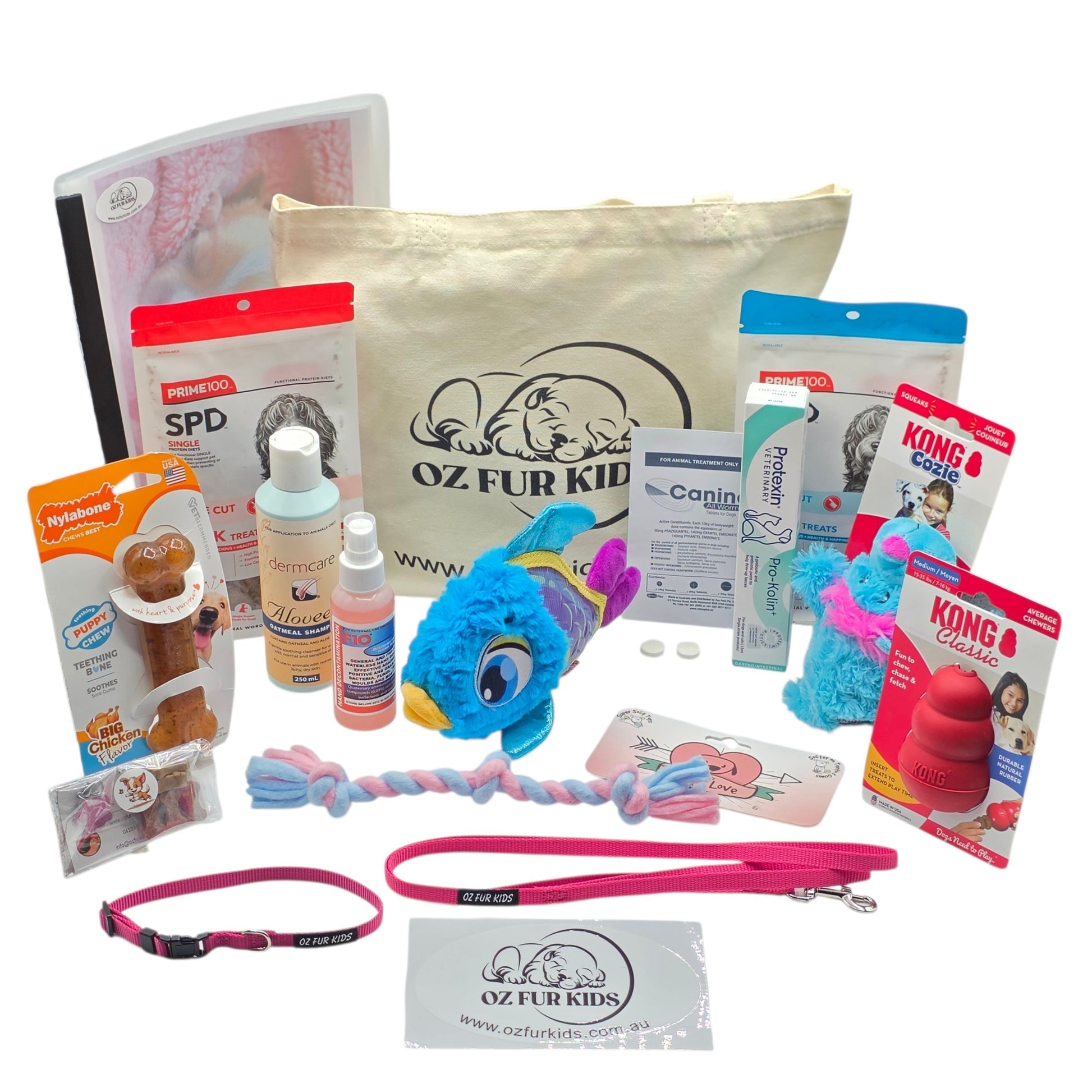 Deluxe Puppy Pack Med/Lg Pink Collection of pet products including toys, treats, and a bag branded 'Oz Fur Kid' on a white background.