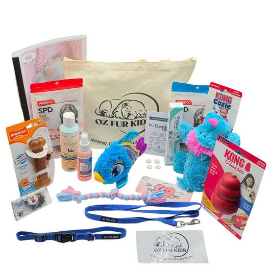 Deluxe Puppy Pack with Assorted pet products including toys, treats, and wormers displayed on a white background.