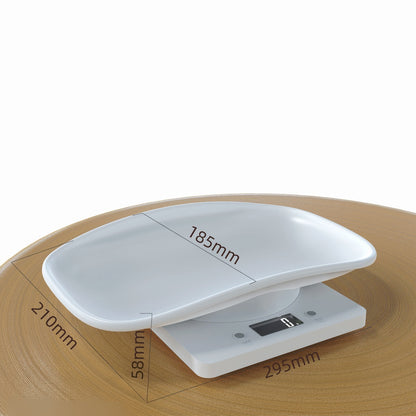White digital kitchen scale on a wooden surface with dimensions indicated