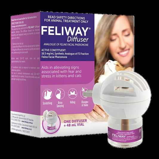 Feliway diffuser packaging with a woman holding a cat on a white background