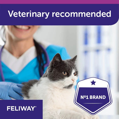 Cat being examined by a veterinarian with FELIWAY branding and 'Veterinary recommended' text.