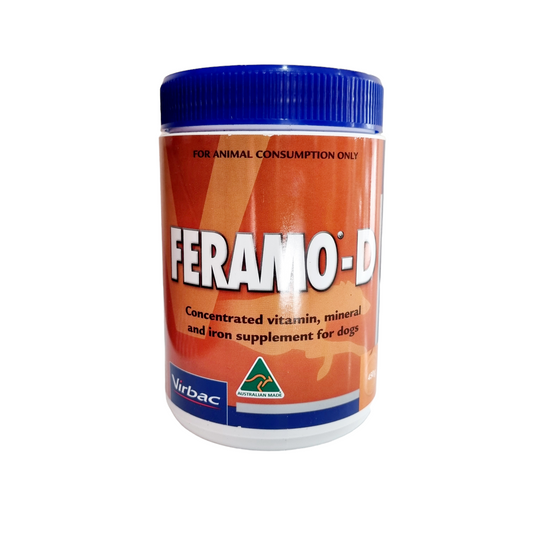 A container of Feramo-D, a concentrated vitamin, mineral, and trace element supplement for dogs, with brand logo and information.