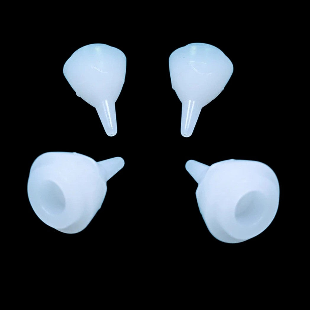 Four SuckleSoft Feeding Teats on a solid black background.