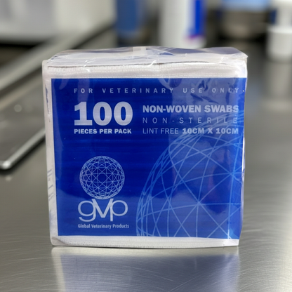 Bag of 100 non-woven swabs for veterinary use on a metallic surface