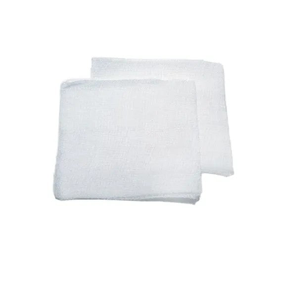 Two white gauze swabs on a white background