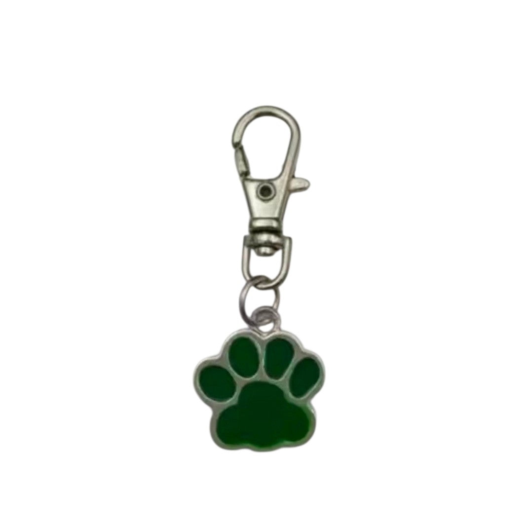 Green paw print keychain with a metal clasp on a white background