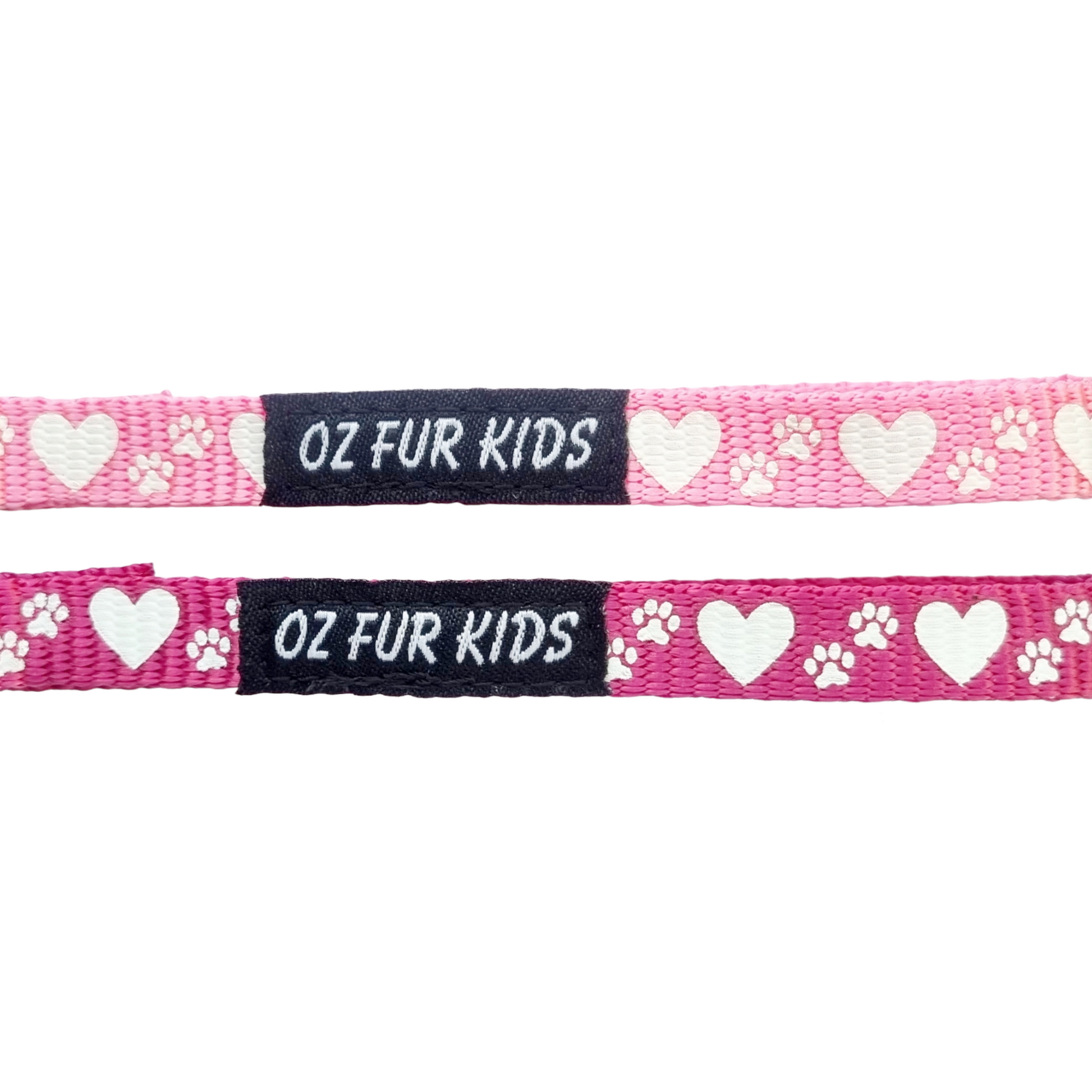 Two pink dog collars with white heart and paw patterns and 'OZ FUR KIDS' branding on a white background.