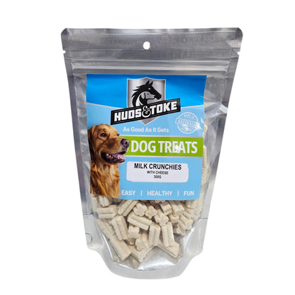 Package of Huds & Toke Milk Crunchies with Cheese dog treats with a blue label and visible dog on a white background