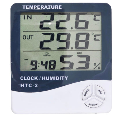 Digital thermometer and humidity meter with clock display on a white background