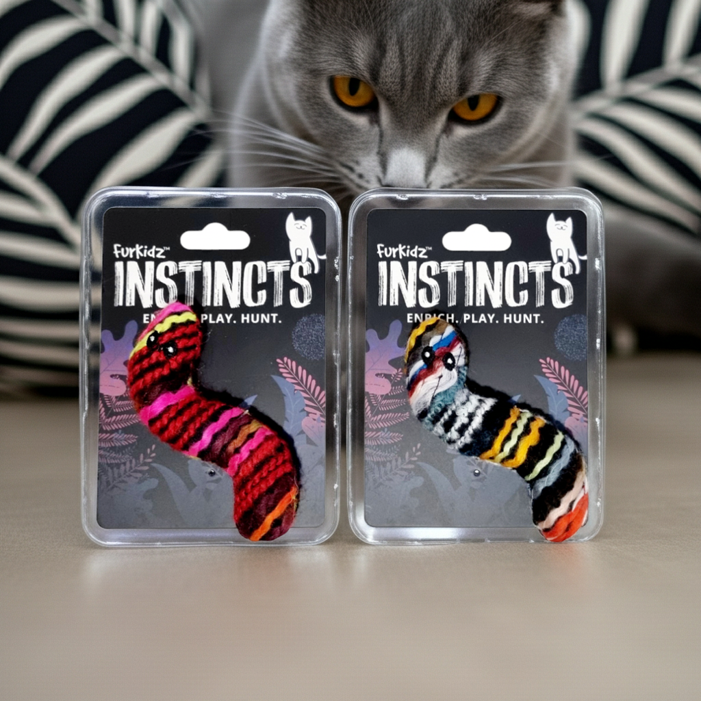 Two packages of Furkidz Instincts cat toys with a gray cat in the background.