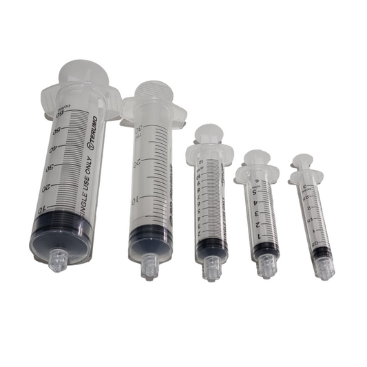 A collection of Luer Lock syringes in various sizes, ranging from 3ml to 60ml, displayed side by side.