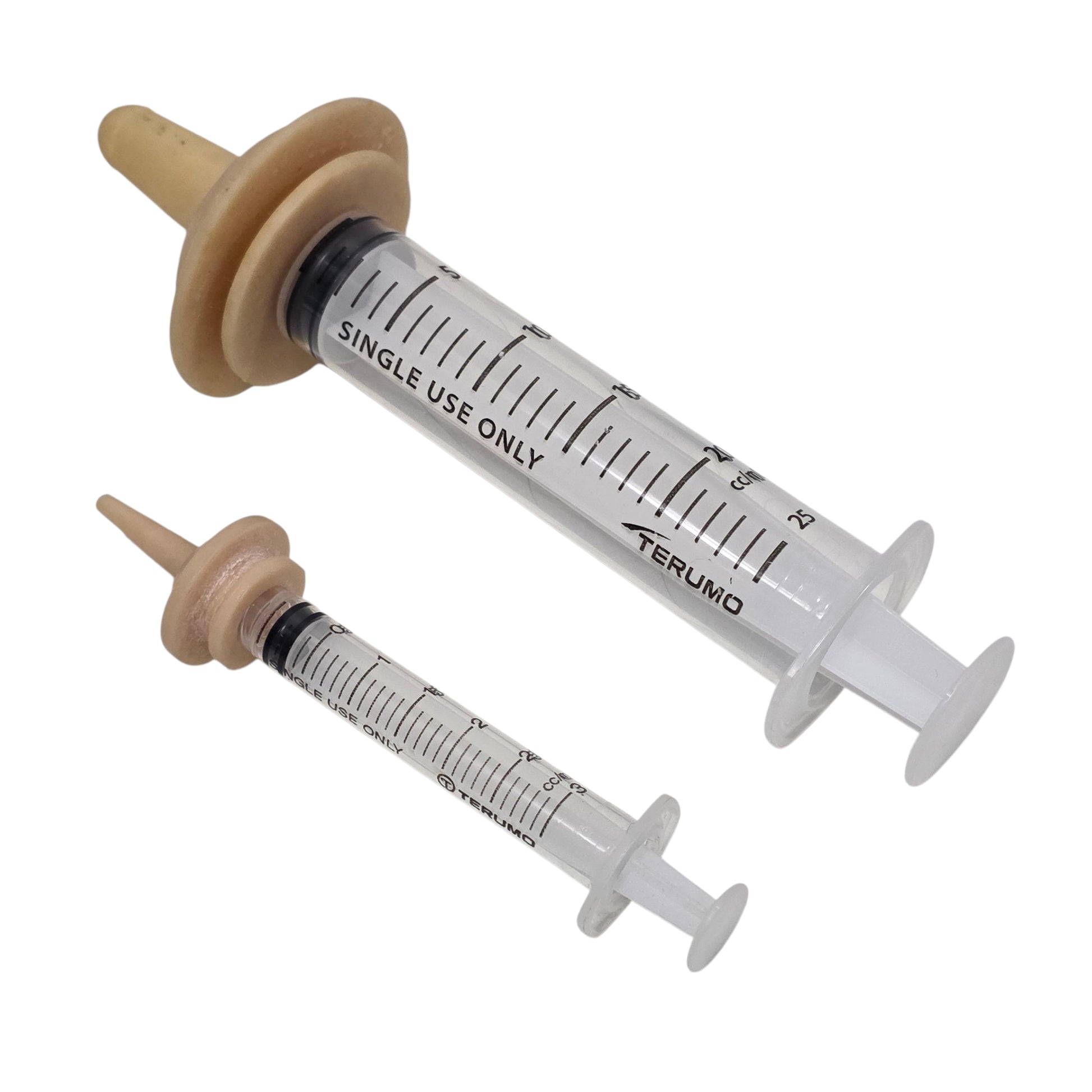 Two luer lock syringes with Miracle Nipples on a white background