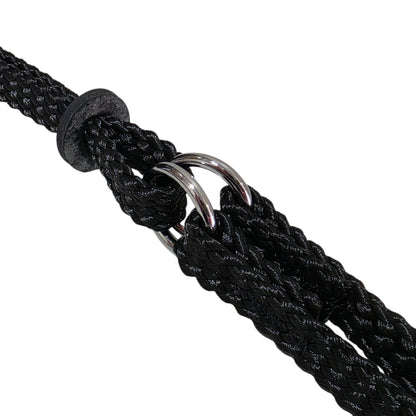 Close-up of a black martingale lead with metal ring on a white background