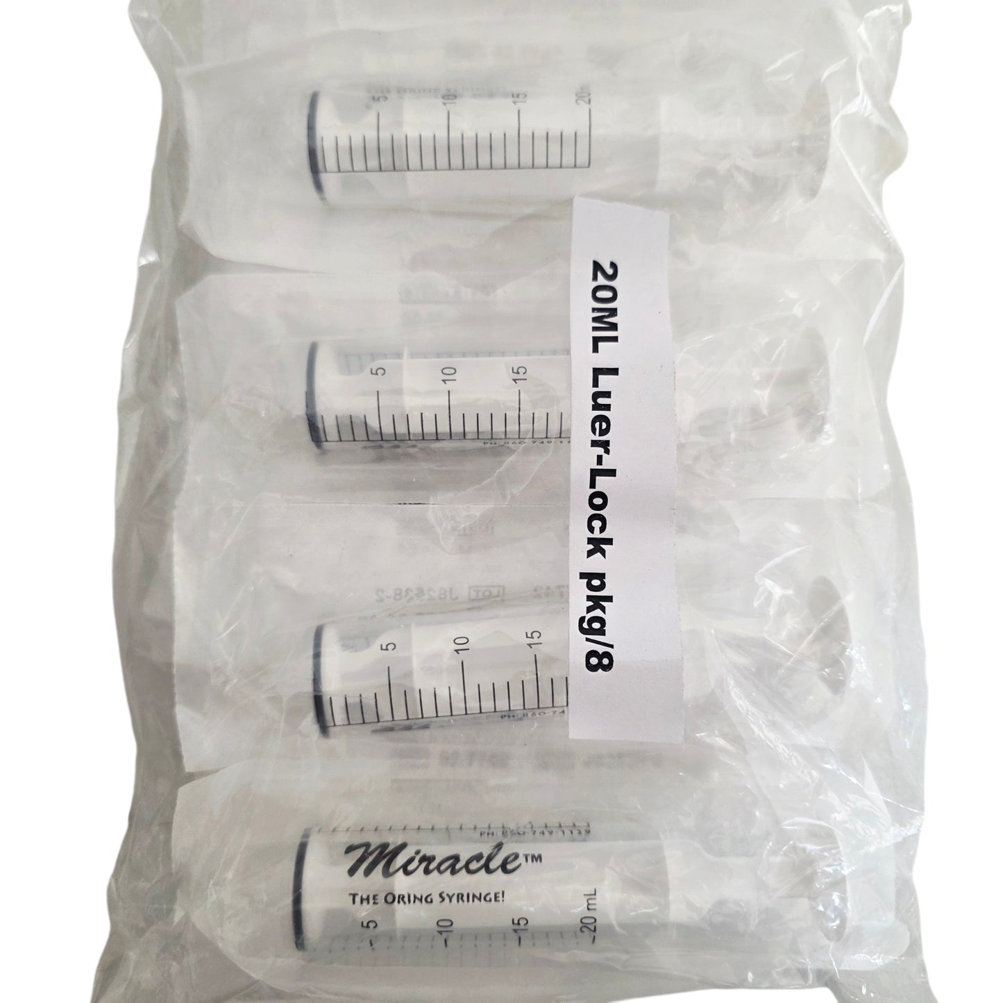 Packet of 8 O ring Miracle Luer-Lock syringes with measurement markings on a white background