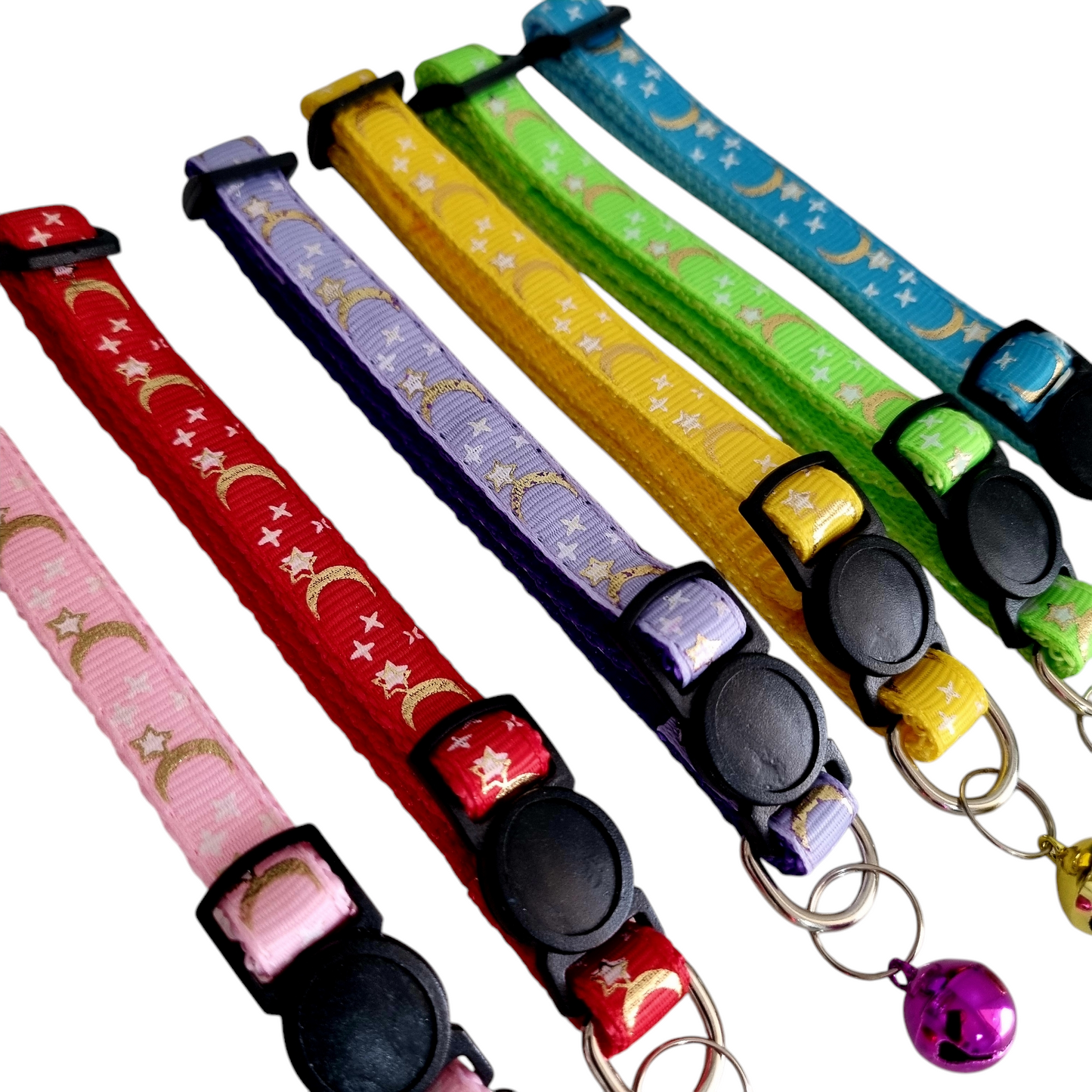 A collection of colorful cat collars with a stars and moons pattern, featuring break-away clasps and bells.