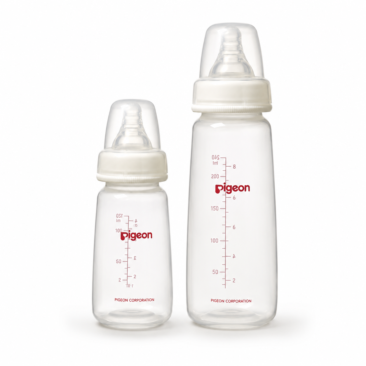 Two Pigeon baby bottles of different sizes with white caps and red measurement markings, shown on a plain white background. The larger bottle is standing upright next to a smaller one.