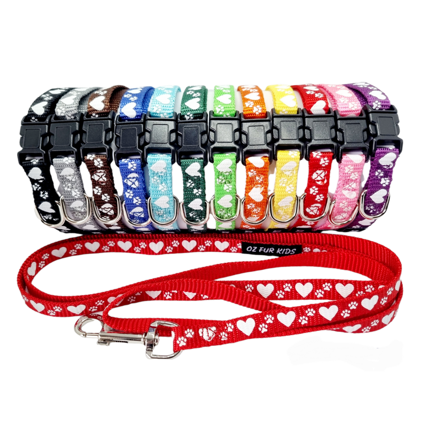 A collection of Oz Fur Kids colorful puppy ID collars with hearts and paw print patterns, accompanied by matching leads. 
