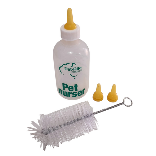 A Pet-Rite Pet Nurser Bottle with two additional teats and a cleaning brush.
