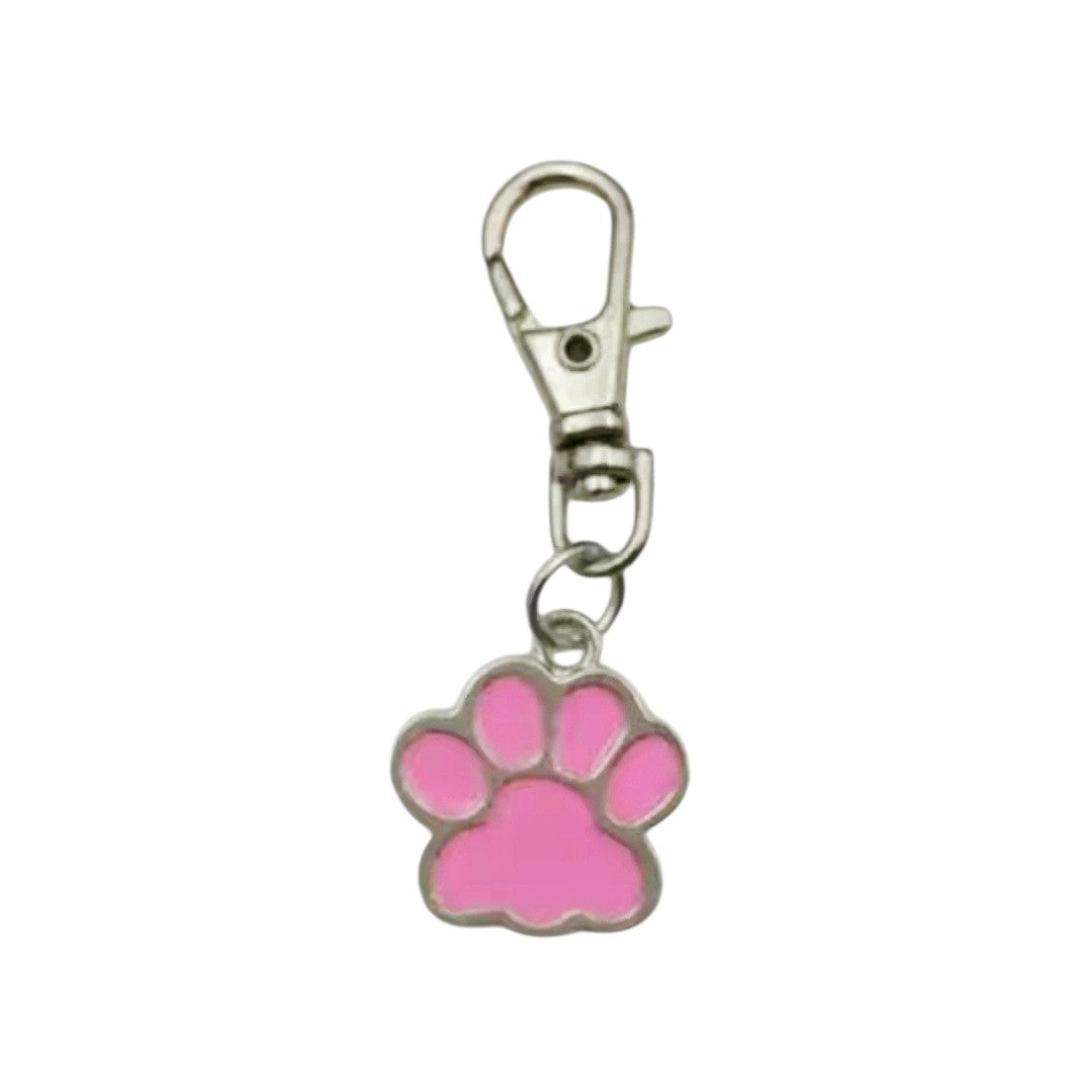Pink paw print keychain with a metal clasp on a white background
