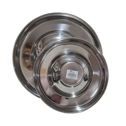 Two stainless steel puppy feeding pans, one large and one small, stacked inside each other with a label in the center.