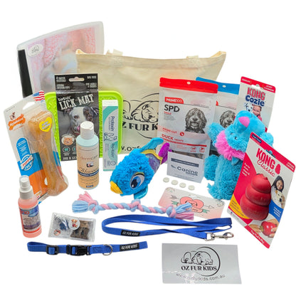 Puppy_Pack_Deluxe_Extra_Large Blue. Assorted pet products including toys, leashes, and grooming items on a white background.
