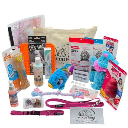 Puppy Pack Deluxe Extra Large Pink. Assorted pet care products including toys, treats, and accessories on a white background