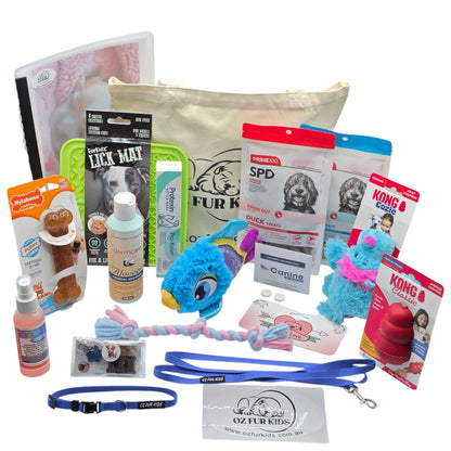 Puppy Pack Deluxe Medium Large Blue. Assorted pet care products including toys, leashes, and grooming items displayed on a white background.