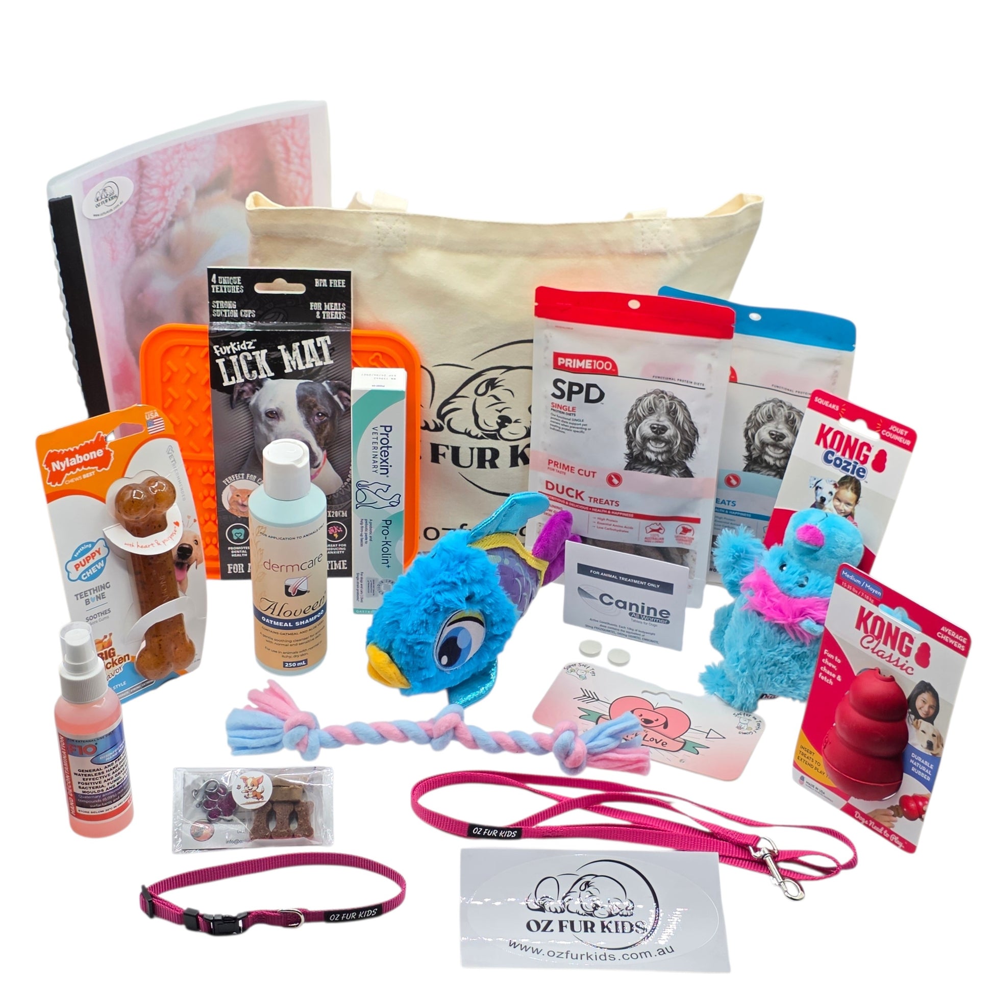 Puppy Pack Deluxe Medium Large Pink. Assorted pet products including toys, treats, and accessories on a white background