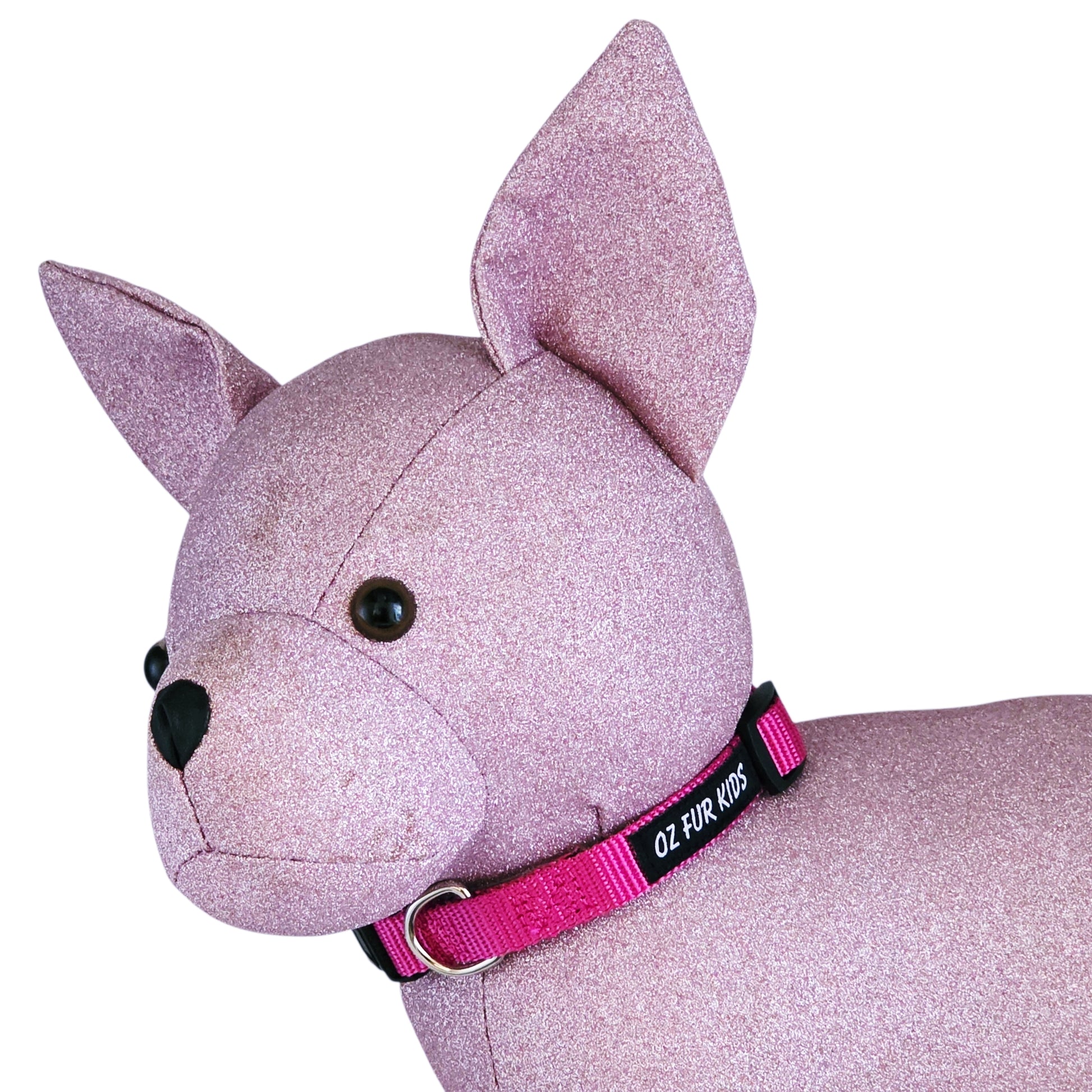 Pink glittery dog toy with a pink collar on a white background