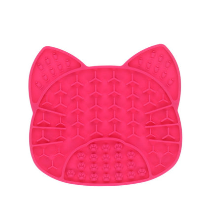 Pink silicone mat with cat ears and paw prints on a white background