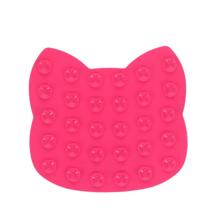 Pink cat-shaped cushion with bubble texture on a white background