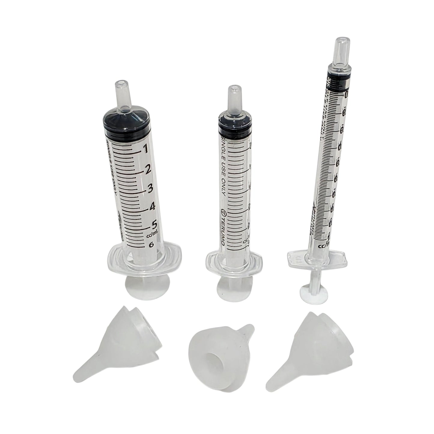 Three clear plastic syringe shown with three SuckleSoft Teats on a plain white background.