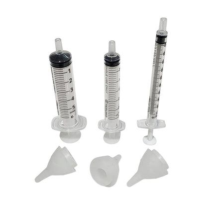 Three clear plastic syringe shown with three SuckleSoft Teats on a plain white background.