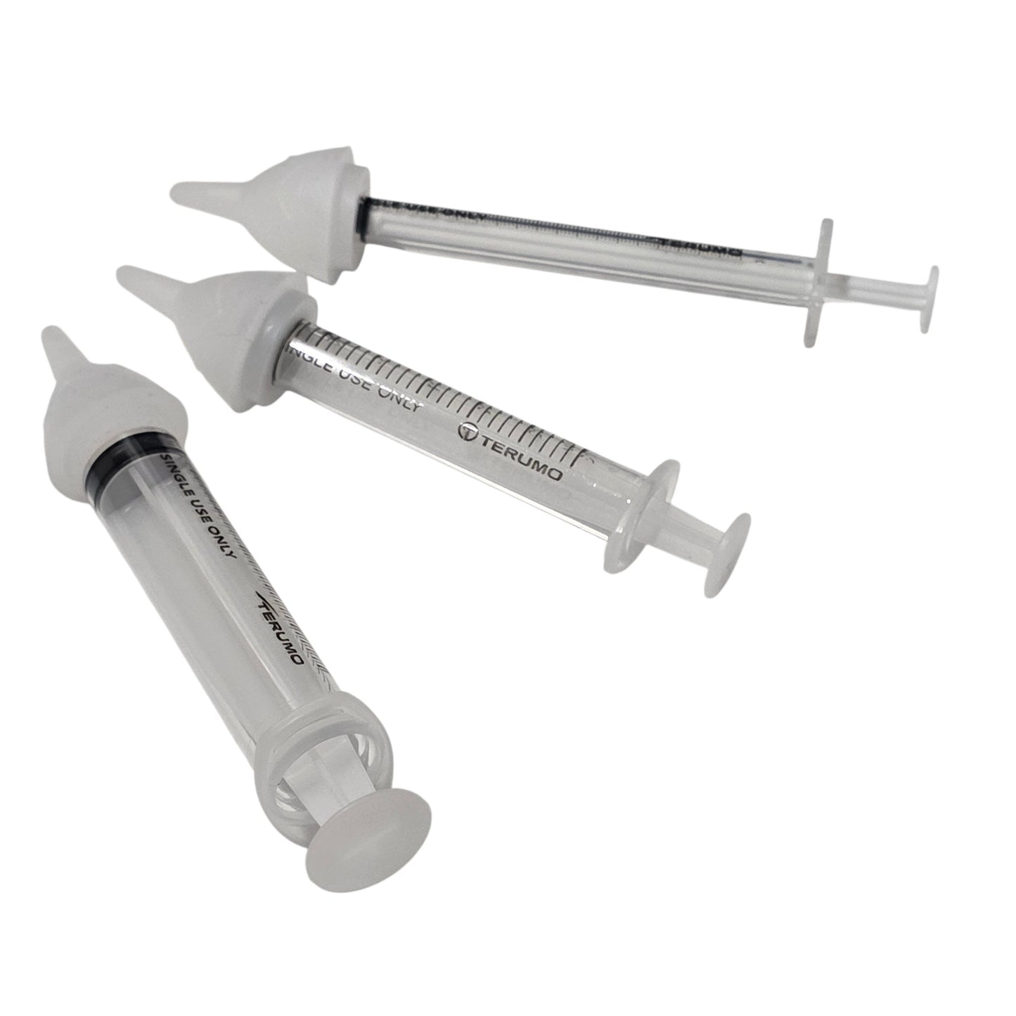 Three clear syringes with three SuckleSoft Feeding Teats, arranged on a plain white background.