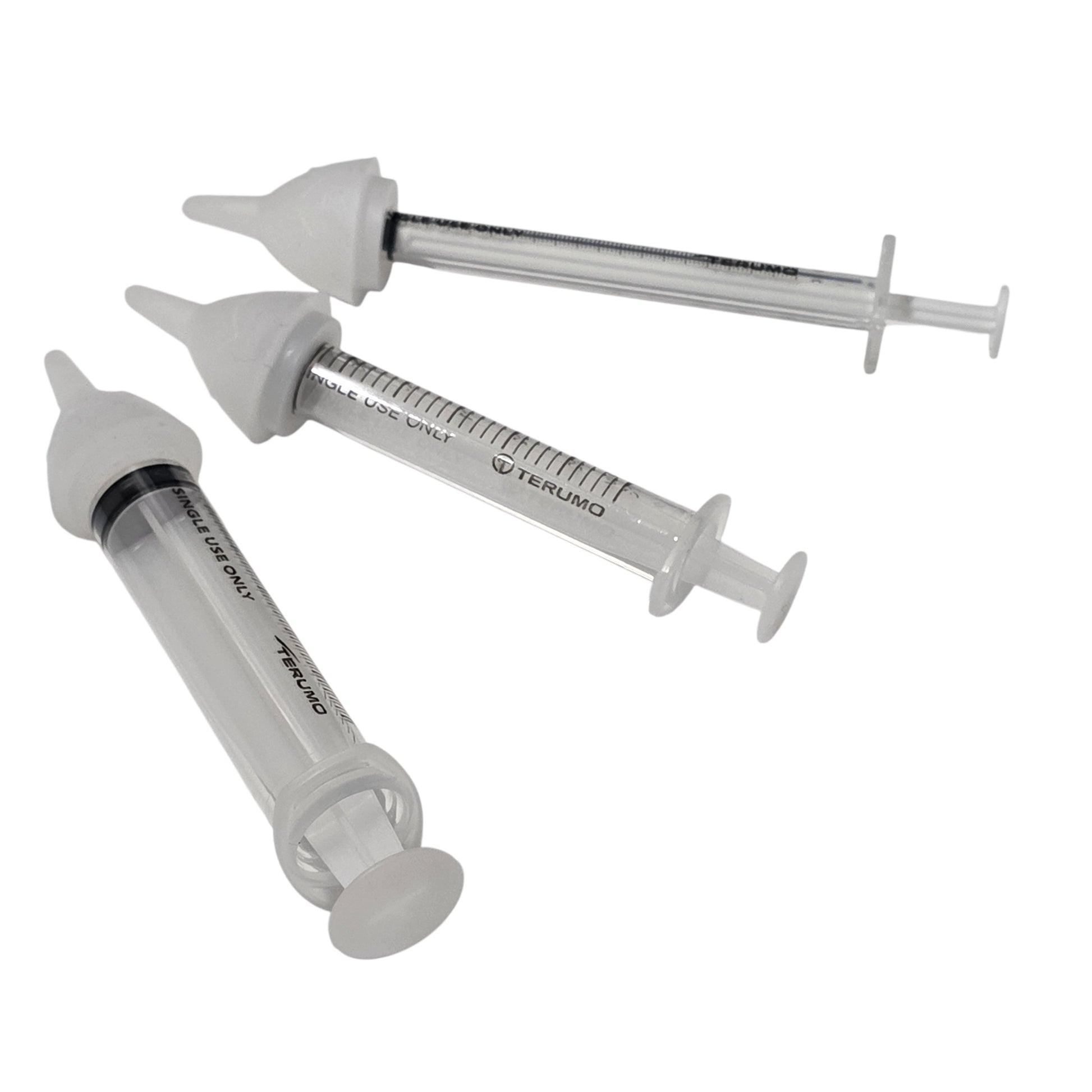 Three clear syringes with three SuckleSoft Feeding Teats, arranged on a plain white background.