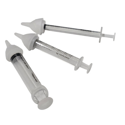 Three clear syringes with three SuckleSoft Feeding Teats, arranged on a plain white background.