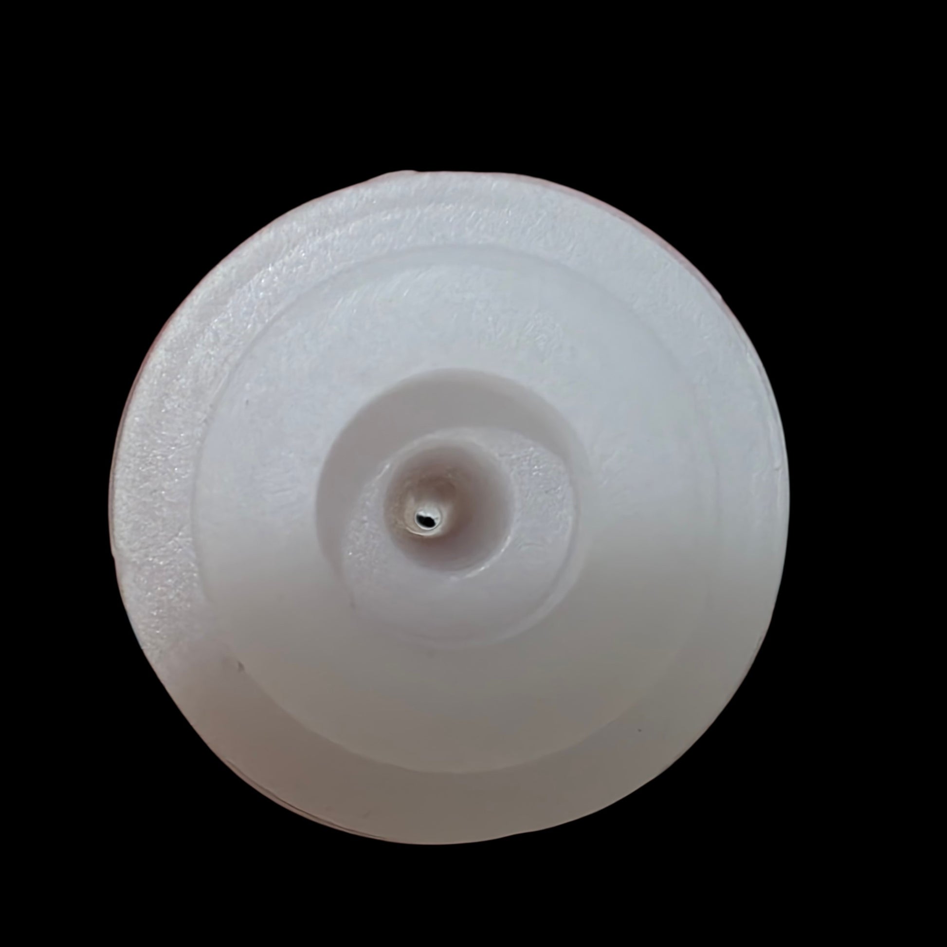 SuckleSoft Feeding Kit showing the small central pre made hole, shown against a solid black background.