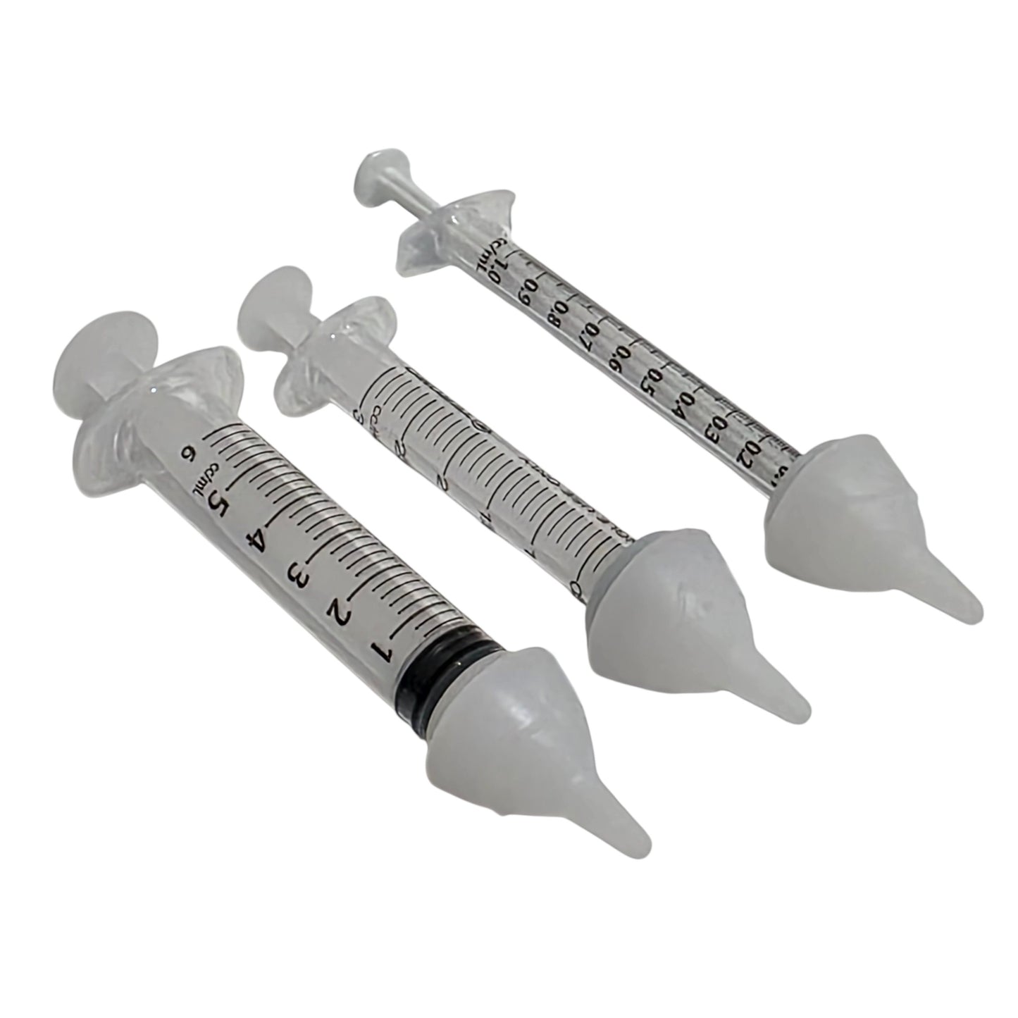 Three clear plastic syringes with SuckleSoft Teats arranged diagonally on a white background.