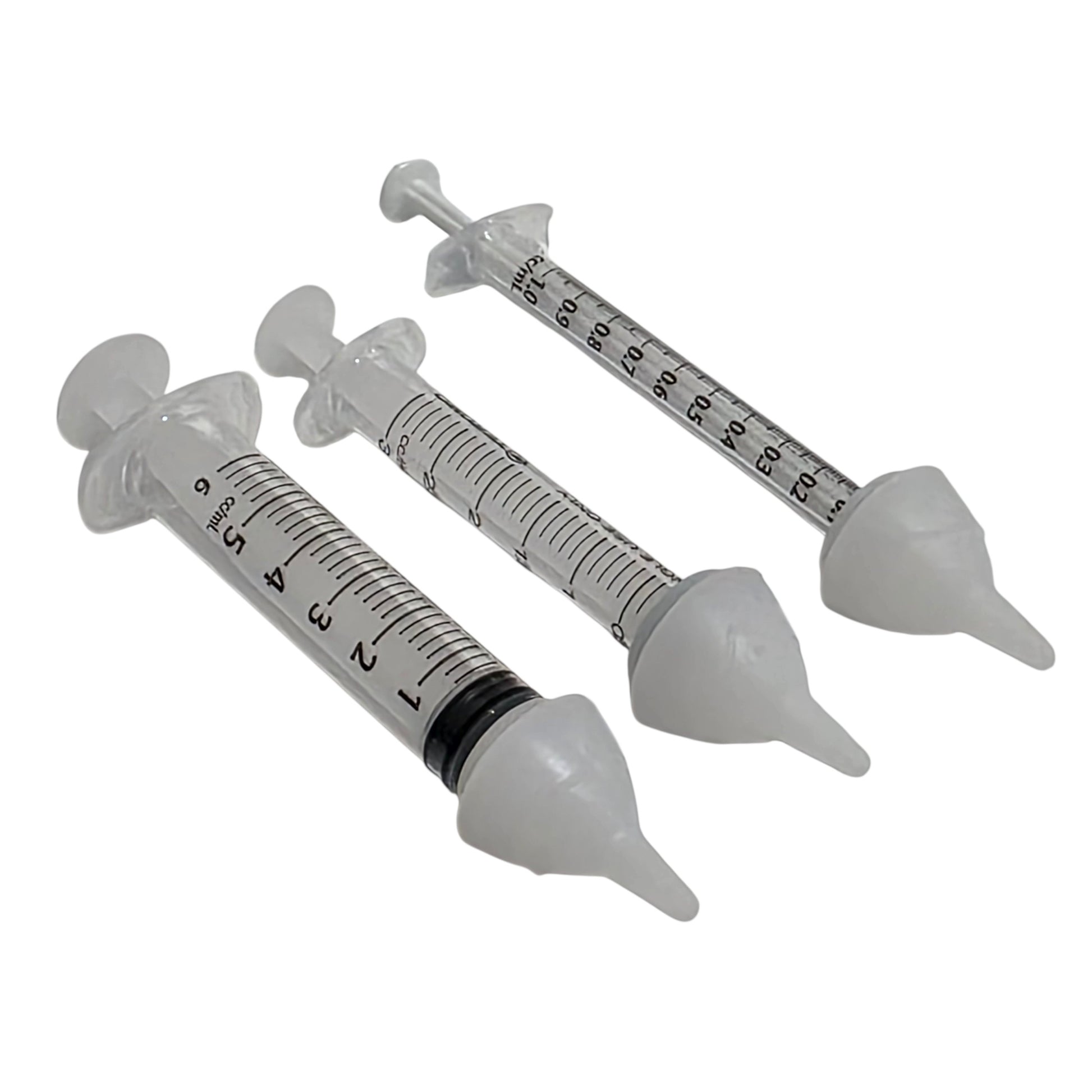 Three clear plastic syringes with SuckleSoft Teats arranged diagonally on a white background.