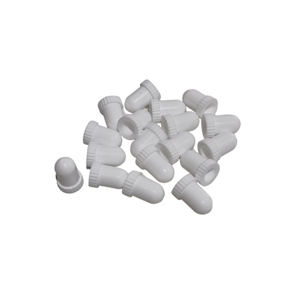 A collection of white, non-sterile syringe caps gathered together.