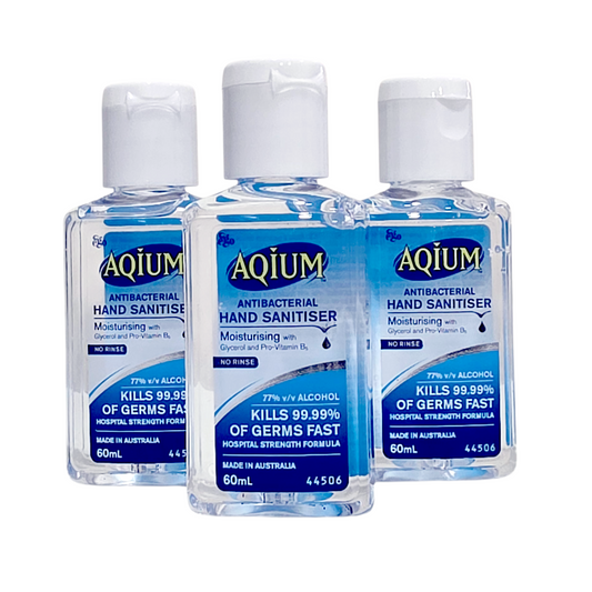 Three bottles of Aquium antibacterial hand sanitiser on a white background
