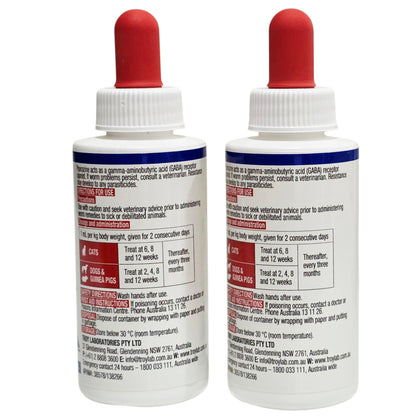 Two Troy Puppy & Kitten Worm Syrup bottles with instructions and red caps on a white background