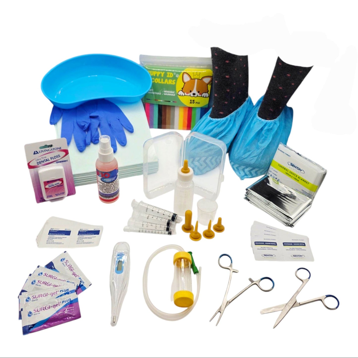 A collection of supplies for the Whelping Kit, including gloves, disinfectant, shoe covers, prep pads, puppy pads, dental floss, a thermal blanket, a bottle and syringe feeding kit, collars, and sterile instruments.
