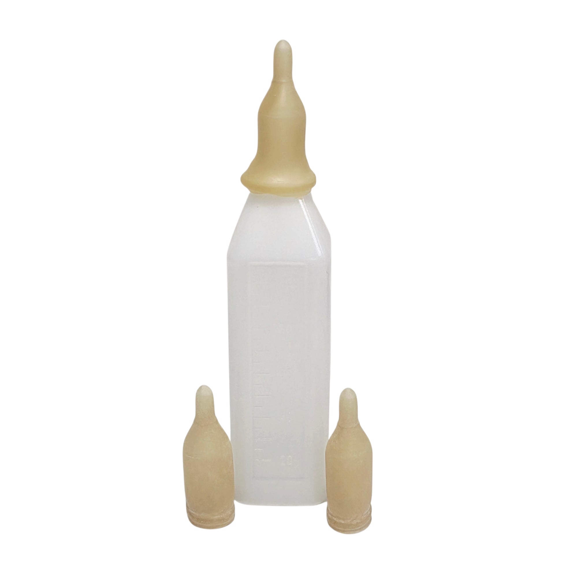 Wombaroo SD Teat on a bottle with two teats in front on a white background