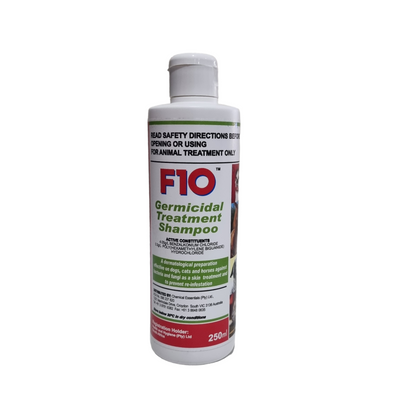 A bottle of F10 Germicidal Treatment Shampoo with product information and dosage instructions displayed on the label.