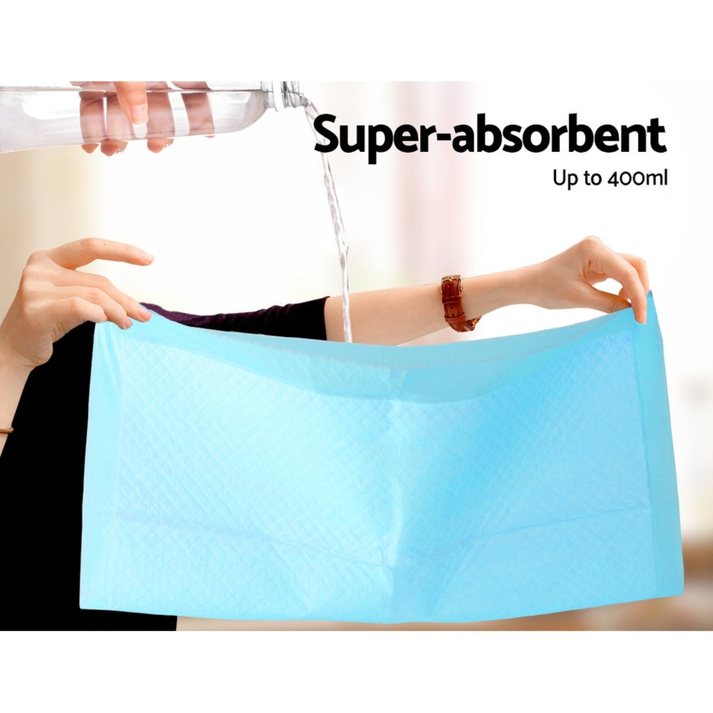 Puppy Pad Super Absorbent being held up